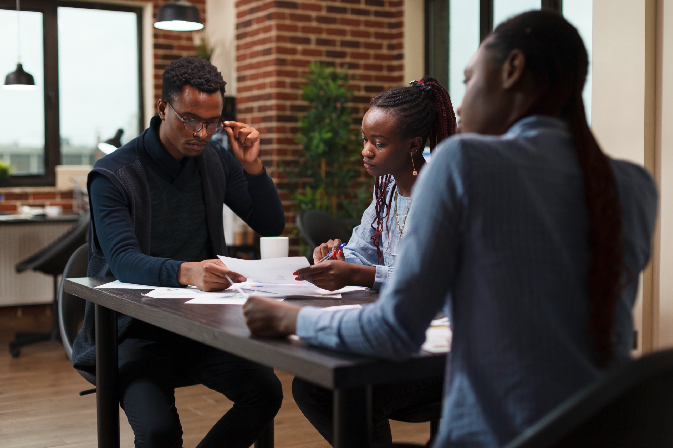 A team reviewing educational program materials